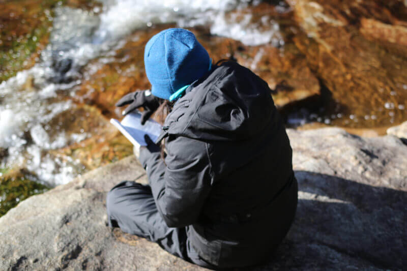Image: Student reading outdoors
